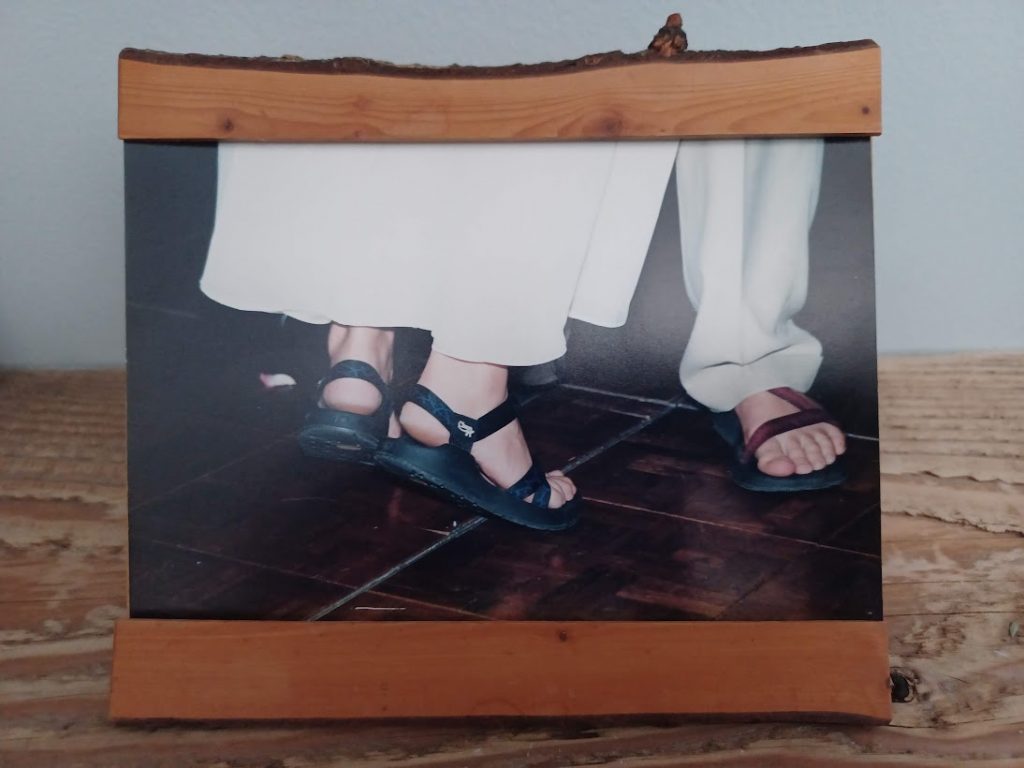 An image of Greg and Emma's tripping sandaled feet during their first dance